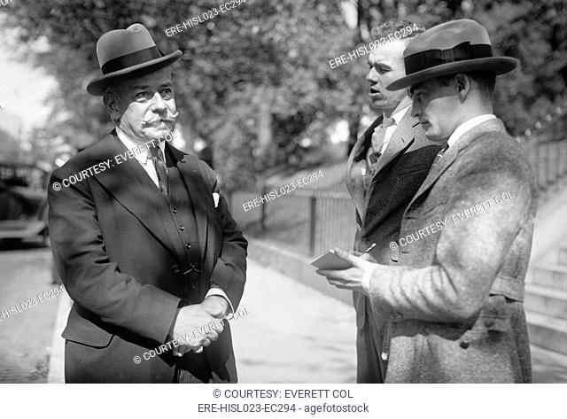 Jules Bache 1861-1944 a German-American stockbroker and banker being interviewed by reporters in Washington D.C. Oct. 22 1922. BSLOC-2010-18-117