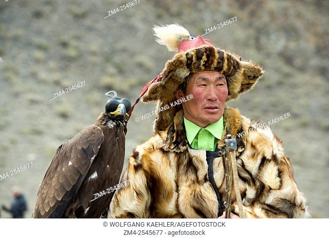 Portrait of Kazakh eagle hunter at the Golden Eagle Festival on the festival grounds near the city of Ulgii (Ölgii) in the Bayan-Ulgii Province in western...
