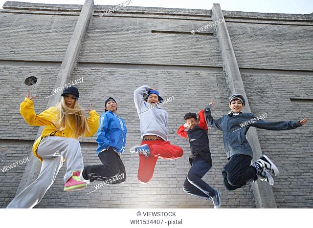 Hip-hop style of the young people jump street dance in the alley