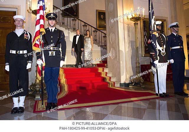 United States President Donald J. Trump and first lady Melania Trump precede President Emmanuel Macron and Mrs. Brigitte Macron of France to have photos taken...