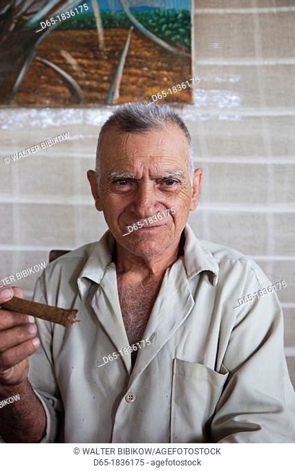Cuba, Pinar del Rio Province, San Luis, Alejandro Robaina Tobacco Plantation, older man with Cuban cigar, NR