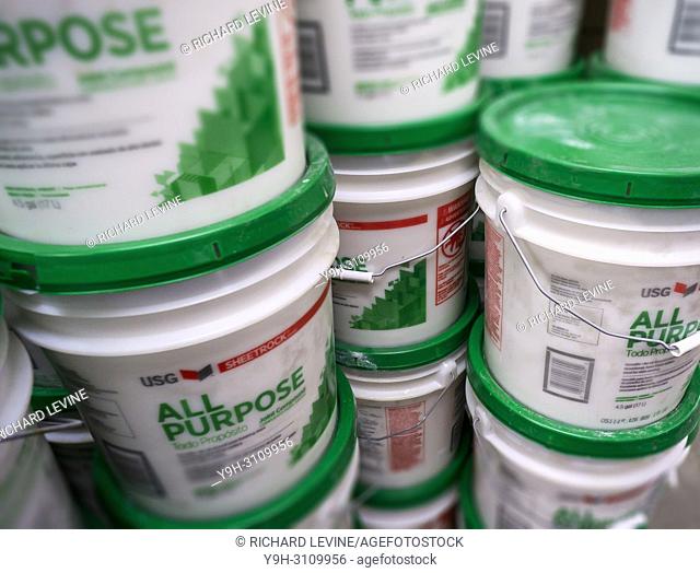 Tubs of USG brand all-purpose joint compound in a hardware store in New York on Tuesday, June 12, 2018. Building material manufacturer USG has agreed to a...