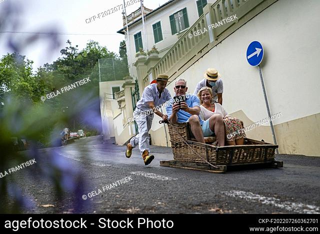 Traditional Monte Toboggans sledge (Carrinhos de Monte) slide from Monte to Funchal on the Portuguese island of Madeira on July 18, 2022