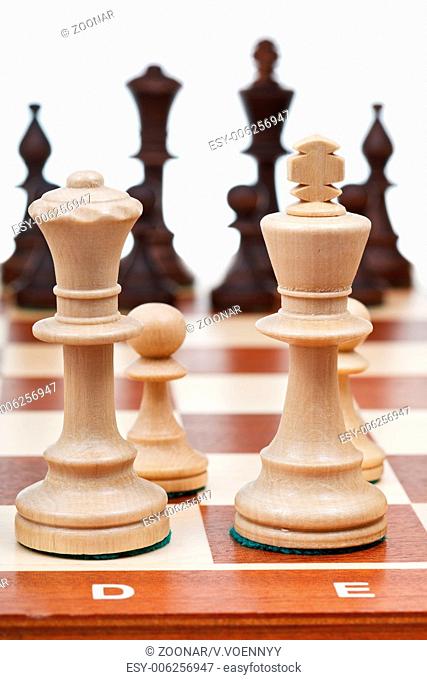 view of set of chess pieces from king and queen