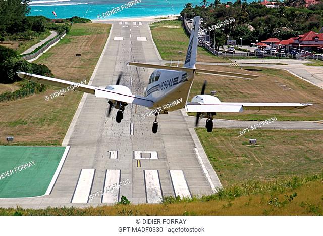 AIRPLANE LANDING AT GUSTAVE III AIRPORT, SAINT BARTHELEMY, FRENCH LESSER ANTILLES, CARIBBEAN