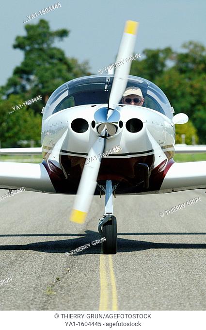 Front view off small sport European LSA Aerospool Dynamic Turbo plane taxing on runway, France