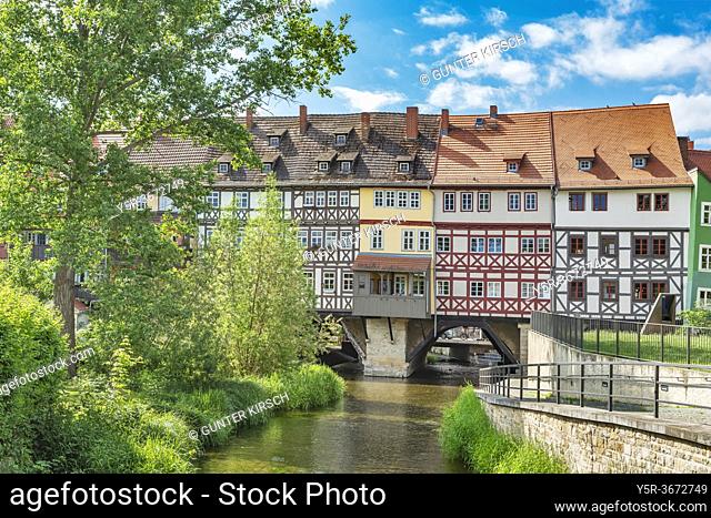 View over the river Gera to the houses of the Kraemerbruecke. The bridge is located in the old town of Erfurt, capital of Thuringia, Germany, Europe