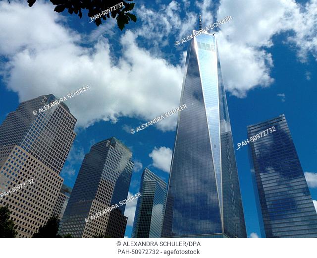 Clouds mirror on the facade of One World Trade Center (WTC 1) office highrise, previously known as the Freedom Tower, situated adjacent to the World Financial...