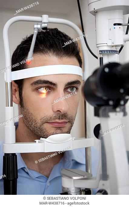 man having his eye's tested