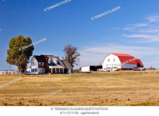 A ranch barn and house in rural Arkansas, USA