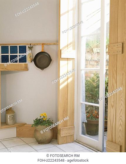 Wooden shutters at French window