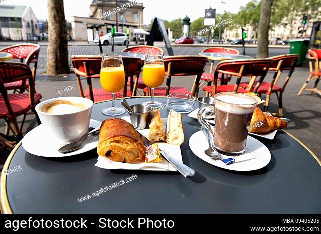 delicious breakfast on a bistro table in the cafe of the officer in the 7th Arrodissement, Paris, France, Europe