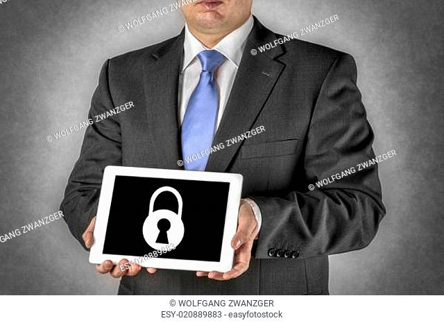 Businessman with tablet computer and padlock