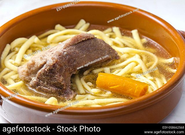 beef bouillon with carrot and noodles