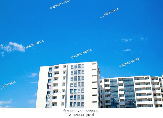 Large apartment building against a blue sky in Poznan, Poland