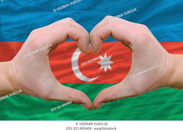 Heart and love gesture showed by hands over flag of azerbaijan b