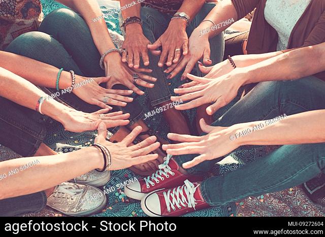 team and friendship concept with crowd of hands and feet all together touching and cooperate - caucasian people friends enjoying the outdoor leisure activity -...