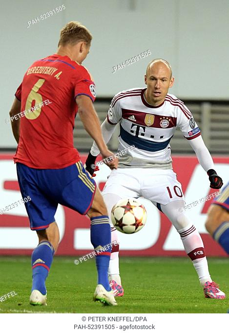 Arjen Robben (R) of Bayern Munich in action against Aleksei Berezutski of CSKA Moscow during the UEFA Champion League Group E soccer match between CSKA Moscow...