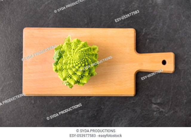 romanesco broccoli on wooden cutting board