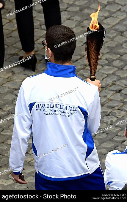 The torch bearer with the torch of peace of the Macerata Loreto pilgrimage during the General Papal audience of Wednesday   , Vatican City, Rome
