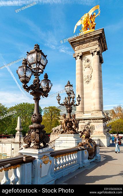 Paris, France, March 31, 2017: Pont Alexandre III in Paris, spanning the river Seine. Decorated with ornate Art Nouveau lamps and sculptures