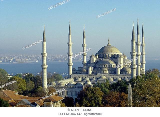 Sultan Ahmet Camii. Blue mosque. Six tall thin towers. Domes. Overlooking water and city