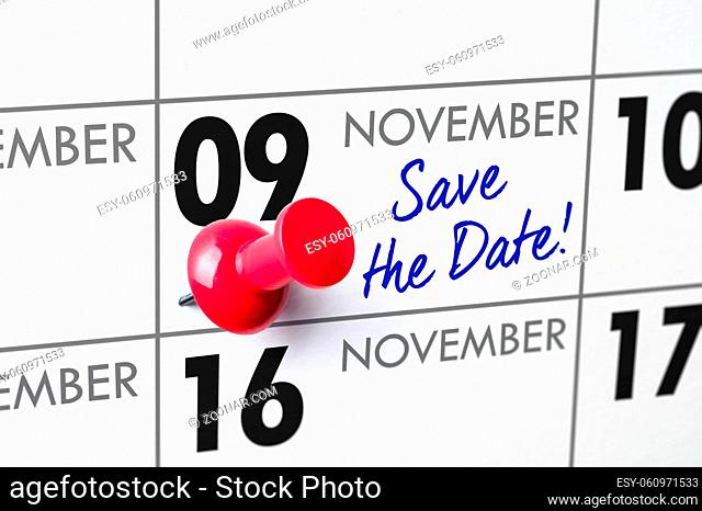 Wall calendar with a red pin - November 09