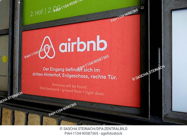 View of a sign with the logo of rental platform airbnb in Brunnenstrasse in the Mitte neighbourhood of Berlin. air bnb is a community marketplace for booking...