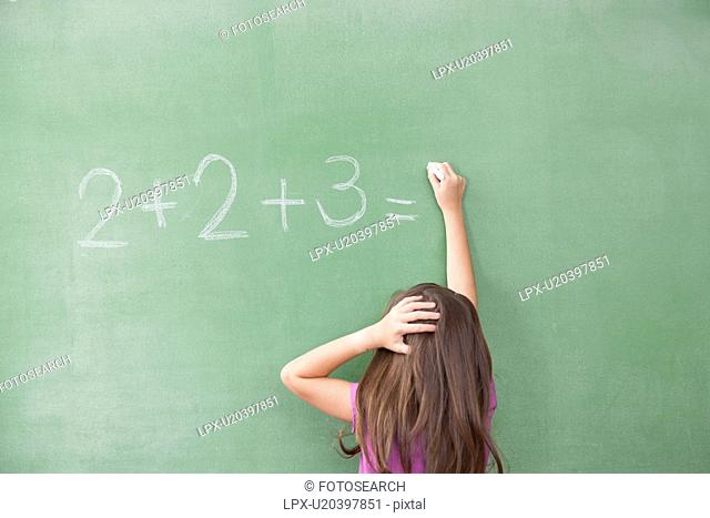 Girl trying do an excercise of math