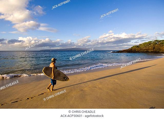 Surfer on Makena Beach or Big Beach, Maui, Hawaii, United States