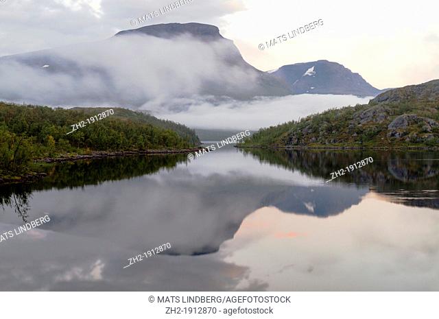 Beautiful reflection of mountain Vassitjåkka in the lake of vassijaure in Swedish lapland