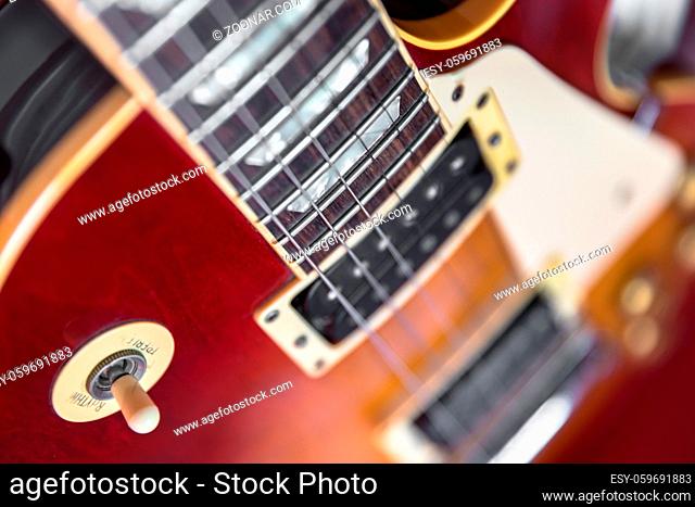 Six-string electric guitar closeup. Vintage style
