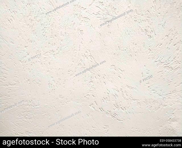 Abstract pink background texture concrete wall . the pink texture of the surface of the wall covered with decorative plaster of the woodworm type