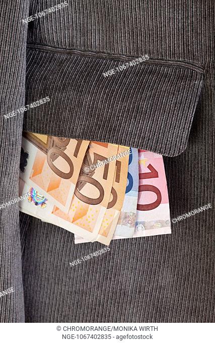 Euro banknotes in the pocket of a jacket