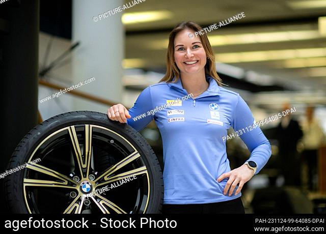 24 November 2023, Saxony, Dresden: Luger Julia Taubitz stands at a tire on the sidelines of the press conference of the German Bobsleigh and Luge Federation...