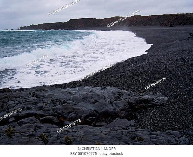 The waves at the black sandy beach of Djupalonssandur in Iceland