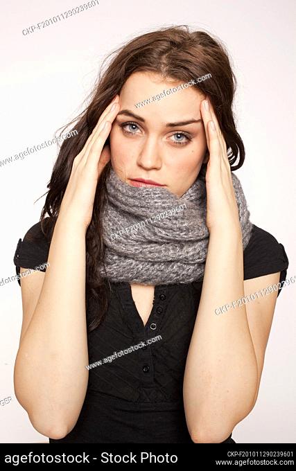 A beautiful young woman, lady, girl, cold, runny nose, headache, scarf  (CTK Photo/Rene Fluger) MODEL RELEASED, MR
