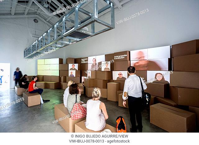 Interior view of pavilion displays and audiovisual installations with visitors. Unfinished - Spain Pavilion at XV Venice Biennale 2016, Venice, Italy