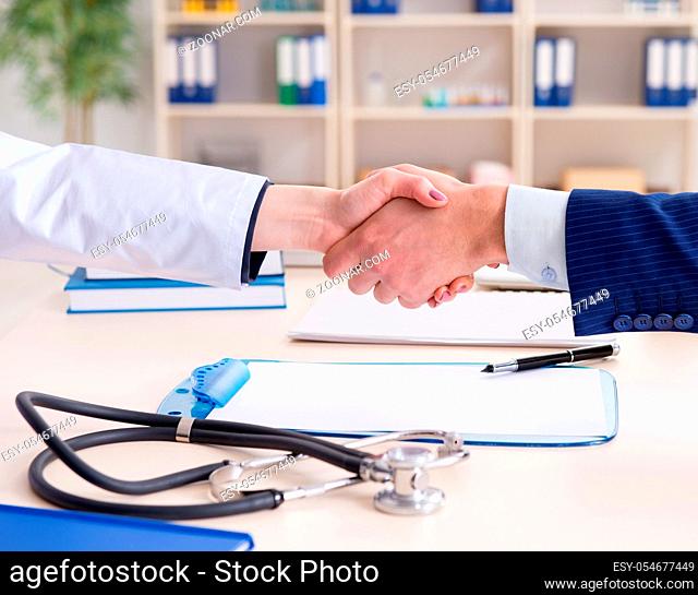 The man signing medical insurance contract
