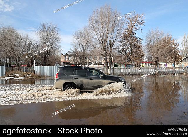 RUSSIA, SAMARA REGION - MARCH 16, 2023: A vehicle drives along a flooded street in the village of Chernorechye. First spring floods have been registered in...