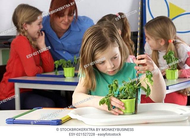 Girl learning about plants in school class