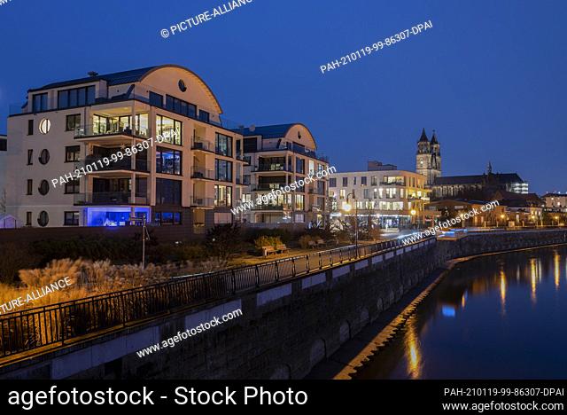 18 January 2021, Saxony-Anhalt, Magdeburg: The Elbe promenade with the Magdeburg cathedral at the blue hour. Photo: Stephan Schulz/dpa-Zentralbild/ZB