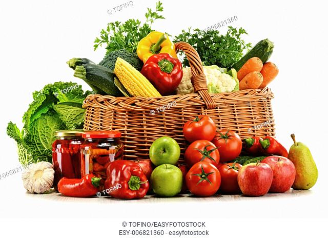 Wicker basket with groceries isolated on white background