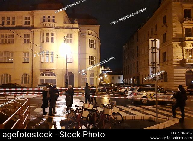 CZECH REPUBLIC, PRAGUE - DECEMBER 21, 2023: Police tape off the scene of a mass shooting outside the Faculty of Philosophy, Charles University