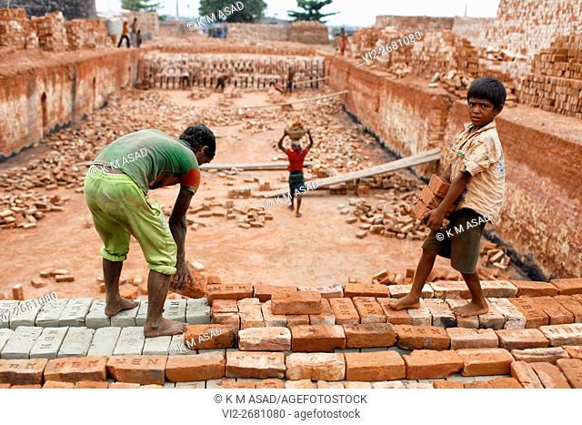 Babu (08) works at a brick factory in Narayangonj, Bangladesh June 01, 2016. He come this place with his family member. This group of people comes from...