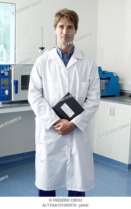 Scientist standing in laboratory, portrait