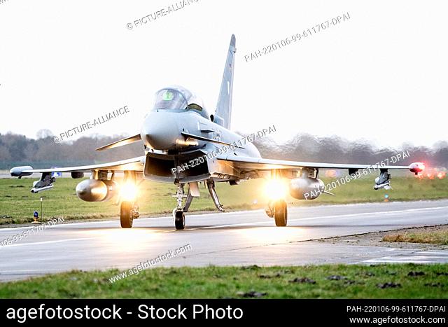 06 January 2022, Lower Saxony, Wittmund: An Luftwaffe Eurofighter Typhoon fighter aircraft drives across the tarmac at Wittmundhafen Air Base
