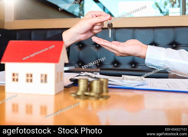 estate agent giving house keys customer sign agreement property for sale, Buying and selling homes concept
