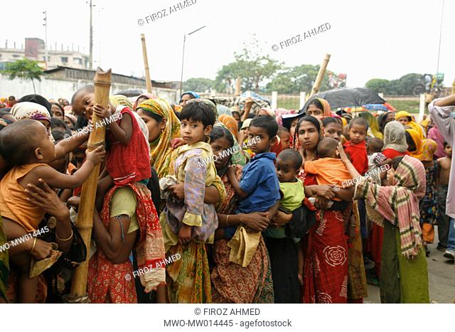 A queue of people to buy rice at a fair price shop, run by Bangladesh Rifles, BDR, at Nababganj Park, near Lalbagh, Dhaka Bangladesh April 04, 2008