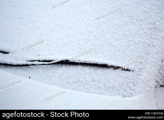 Close up of car covered in a fresh layer of snow